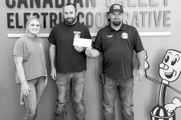 Canadian Valley Electrical Co-op (CVEC) recently presented a grant check to the Strother Volunteer Fire Department through CVEC’s Sharing Success program. Pictured l-r: Kaci Dennis, CVEC; Strother Fire Dept. Captain Derek Young and Ryan Lehman, Strother