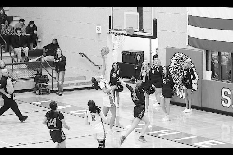 Varnum Lady Whippet Jazmyn Williams goes up for the shot as Strother Lady Yellowjacket Ava Kornelsen tries to block the shot. Varnum won 49-40. Courtesy Photo by Jeanne Gosa