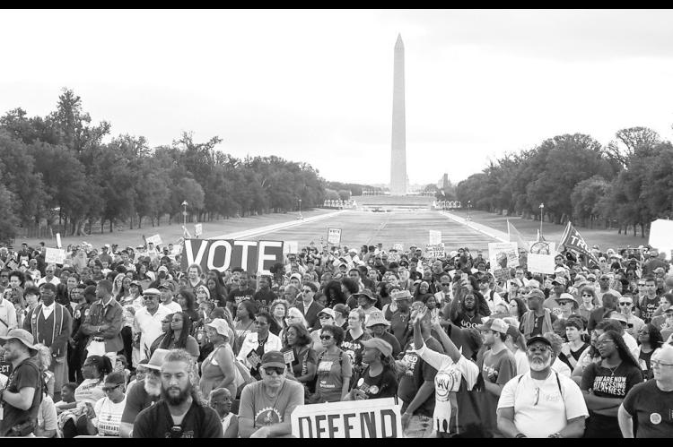 Demonstrators gathered at the Lincoln Memorial Reflecting Pool in Washington, D.C., on Friday, Aug. 28, 2026, marking the 63rd anniversary of the March on Washington for Jobs and Freedom where the late civil rights leader Rev. Martin Luther King Jr. delivered his “I Have a Dream” speech. (Photo by Ashley Murray/ States Newsroom)