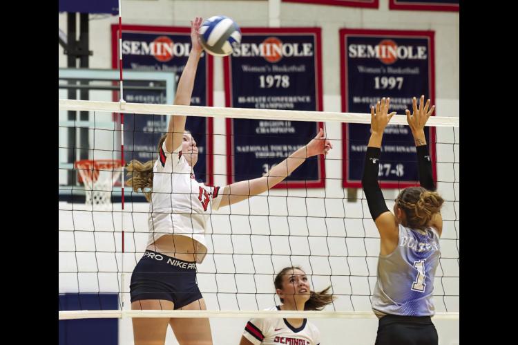Seminole State Lady Trojan Melanie Long sends the ball back across the net Tuesday. Courtesy Photo by Glen Bryan
