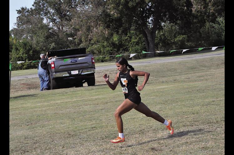 Wewoka Lady Tiger Priscilla Alaniz places first in the 3200m run at OBU Thursday. Staff Photo by Bill Anderson