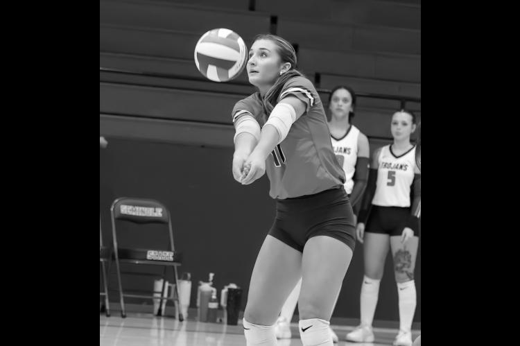 Seminole State Lady Trojan Lilia Benoit returns a serve to her front line. Courtesy Photo by Glen Bryan