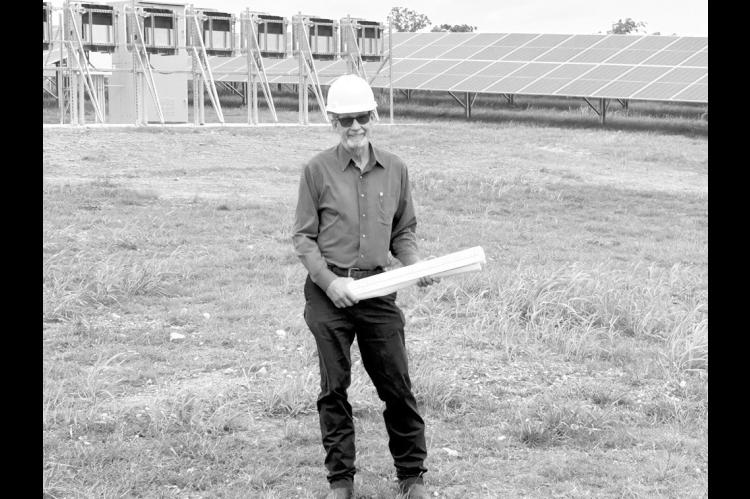 James Larson, director of plant operations, SSM Health St. Anthony Hospital – Shawnee, stands in the field near the hospital’s solar panel field. The power from the solar panels runs underneath the street towards the SSM Health Medical Group building and then on to the adjoining hospital. (Photo provided)