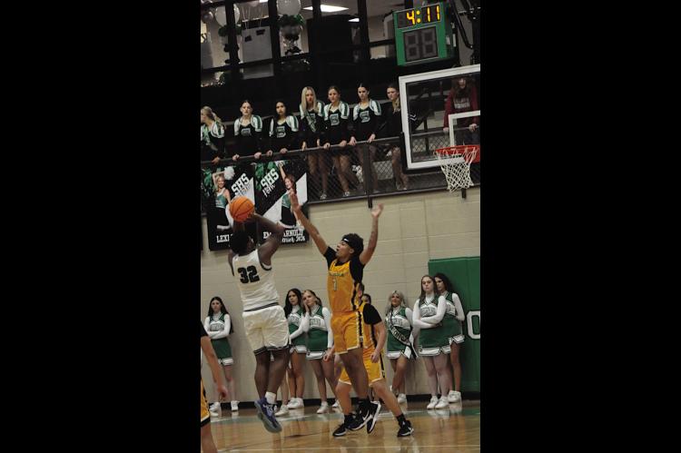 Seminole Chieftain Chris Brager shoots the jumper over his defender. Staff Photo by Bill Anderson