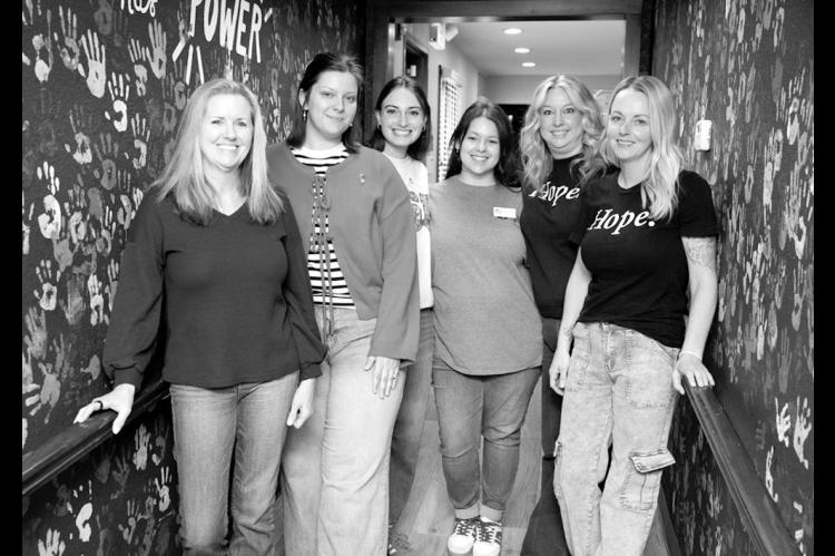 Abbott House Child Advocacy Center Executive Director Kylie Turner, far left, poses with the Abbott House staff. Pictured left to right are Bridget Lozano, Taryn Horeink, Ally Myer, Anna Adkins and Jordan Powers. (Brent Fuchs/Oklahoma Watch