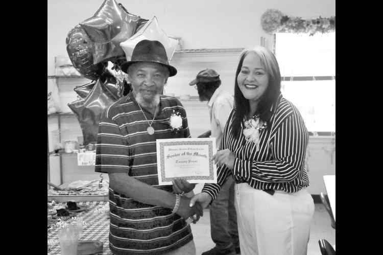 Tommy Payne was named the Wewoka Senior Citizens Center’s “Senior of the Month” on May 1. City Manager Rebecca Stone presented Payne with a special certificate and he will park in a special parking spot for the entire month. —Staff Photo by Bill A