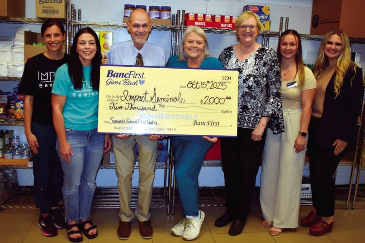 BancFirst Seminole made a $2,000 donation to Impact Seminole, a local nonprofit, last week that will be used to stock the food pantry at Seminole Public Schools. Pictured l-r: Jenna Geohagen, Emily Payne, Superintendent Dr. Bob Gragg, Callie Giles, BancFi