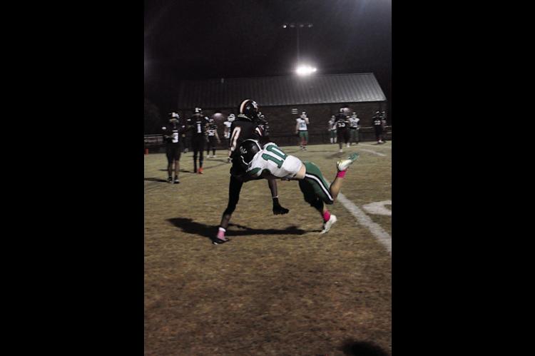 Wewoka Tiger Bill Stephens forces his way into the endzone Thursday night. Staff Photo by Bill Anderson