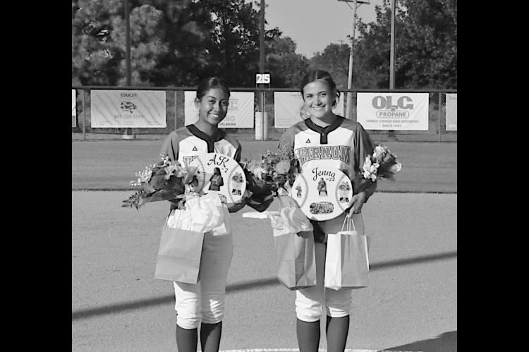 Varnum Lady Whippet Seniors AK Prieto and Jenna Lofton are honored before the game. Staff Photo by Bill Anderson