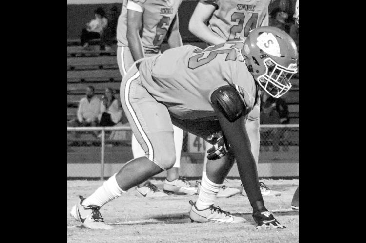 Seminole DE Ty Washington gets ready to rush the Checotah passer in Friday night’s game. (Photo by Ben Schatzel)