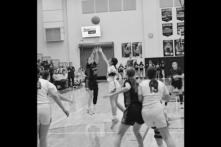 Seminole Lady Chieftain Aundrea Tagg takes the shot from three-point range Saturday night. Staff Photo by Bill Anderson