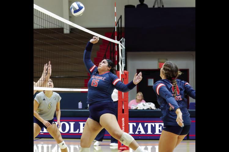 Seminole State Lady Trojan Losaline Makahununiu puts the ball back over the net. Courtesy Photo by Glen Bryan