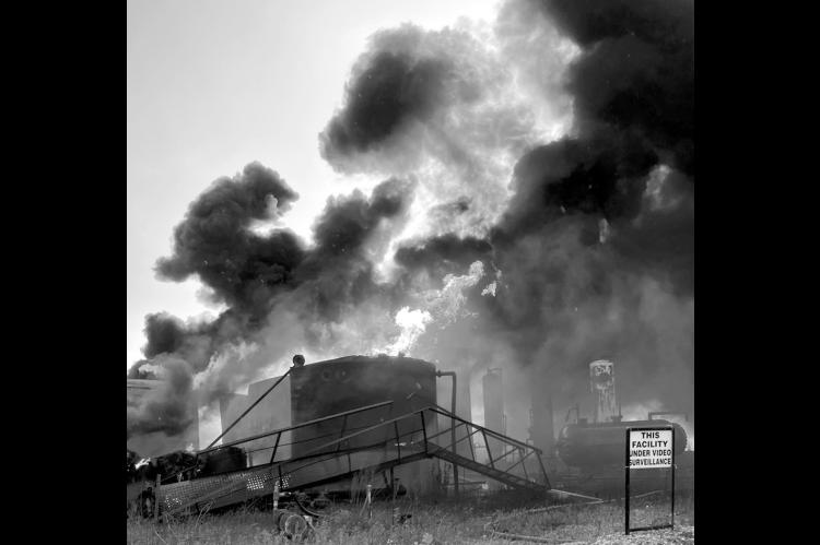 Multiple fire departments from across the Seminole County responded to a tank battery fire near Highway 9 and NS 3640 late Tuesday night. The glow from the blaze, caused by a lightning strike, was reportedly visible for miles. —Photo courtesy Aaron Sowd