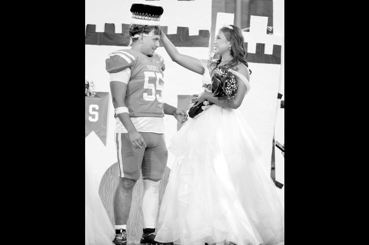 Seminole High School Homecoming Queen Tafv Stewart crowns Aiden Napier king during homecoming festivities ahead of the Chieftains matchup against Pauls Valley Friday night. The Chiefs prevailed 24-22. See page 5 for more details. —Photo by Ben Schatzel