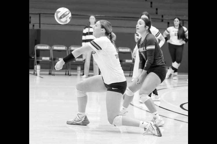 Seminole State Lady Trojan Malerie Hawk returns a serve to her front line. Courtesy Photo by Glen Bryan