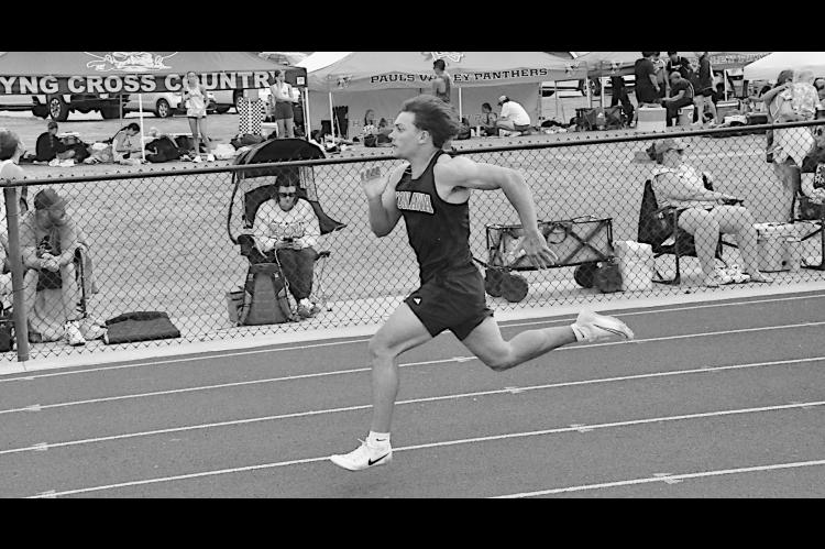 Konawa Tiger Layne Akerman sprints to the finish line in first place in the 100M Friday. Staff Photo by Bill Anderson