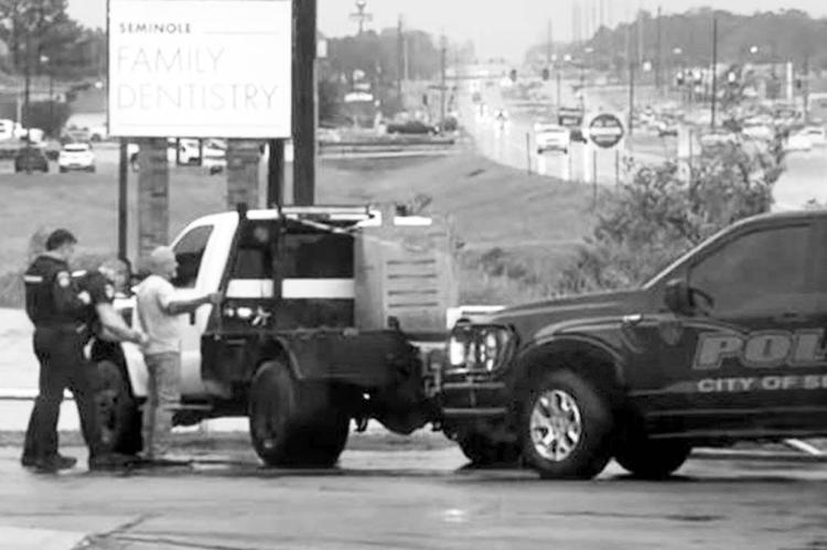 Above: Seminole Police officers arrest Thomas Agler Saturday, Oct. 18 in a business parking lot on North Milt Phillips. Agler, who pleaded no contest earlier this month to embezzlement and received probation, faces extradition to Ohio for parole violation