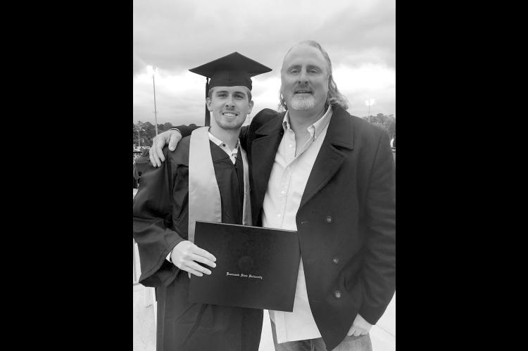 Erik Watts with son, Noah, at his graduation from Kennesaw State University in Kennesaw, Georgia. (Photo provided)