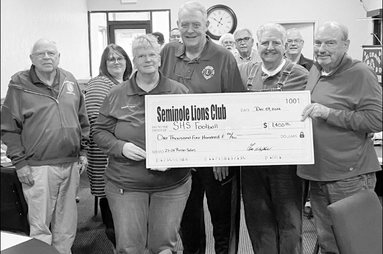 Right, the Seminole Lions Club this week presented Seminole High School Football Head Coach Mike Snyder with a $1,400 check from the sale of rosters at home games during the 202324 season. Pictured presenting the check are Sequeeta Potter, Neil Craig and 