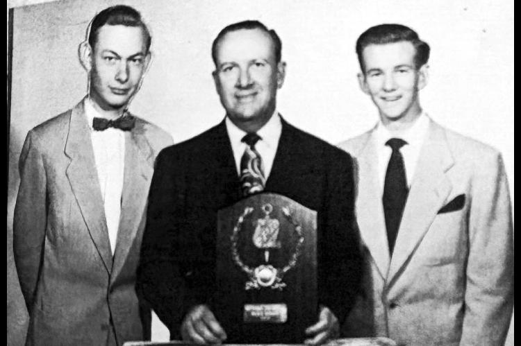 From left, Bill Wantland, Seminole High School Principal and Debate Coach Harland B. Mitchell and Tommy Kelton pose following the team’s 1952 national debate championship in Pueblo, Colorado. Mitchell holds a plaque from Phi Rho Pi, a national forensic fraternity, honoring the Seminole Junior College championship team. (Provided)