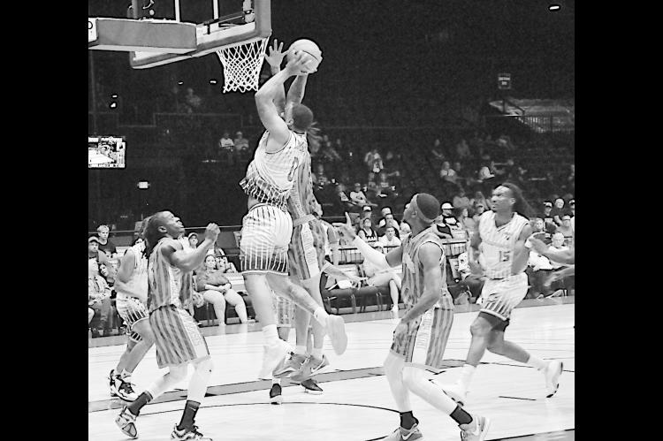 Potawatomi Fire Deshawn Munson goes in for the slam Saturday night. Staff Photo by Bill Anderson