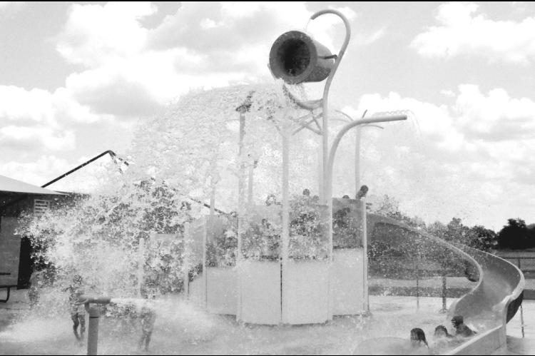 In this file photo from 2024, cool refreshing water gets dumped on children as they play in Seminole’s Splashpad, located in the municipal park. City officials announced Tuesday that the popular water attraction will be closed all day this Saturday, July 4. The annual fireworks display is typically launched from an area near the splashpad beginning at dusk. —File photo