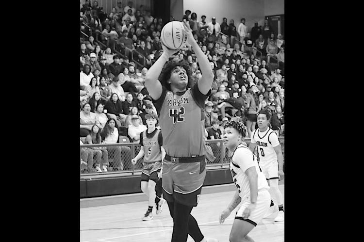 Varnum Whippet Jon Madkins gets the rebounds and makes the shot Saturday night. Courtesy Photo by Jeanne Gosa