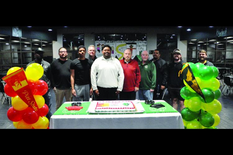 Seminole Football had 2 signings Wednesday. Dontre Garfield signed his letter of intent with Pittsburg State and Martez Johnson signed his letter with OBU. Pictured is Dontre and Martez with Seminole High School coaches. Staff Photo by Bill Anderson