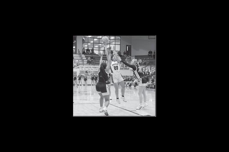 Seminole Lady Chieftain Dyliah Hymes shoots over the Okemah defenders Friday night. Courtesy Photo by Glen Bryan
