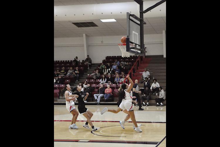 Seminole State Belle Nazhoni Sleeper flies in for the layup Monday night. Lady Belles won 105-47. Staff Photo by Bill Anderson