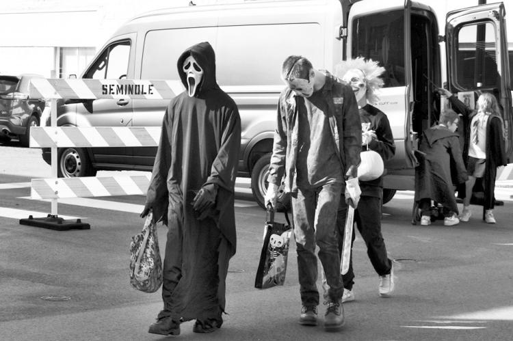 A handful of ghoulish characters make their way across Main Street in Seminole Friday afternoon during the Trunk or Treat event, which drew large numbers of people of all ages. The event included carnival games, a pumpkin decorating contest, a costume con