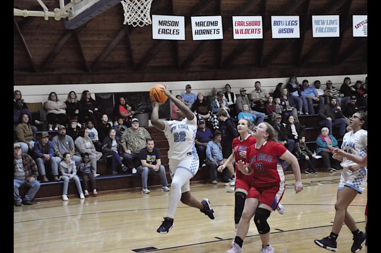 New Lima Falconette Aubrey Washington flies in for the layup Thursday night against Life Christian. Staff Photo by Bill Anderson