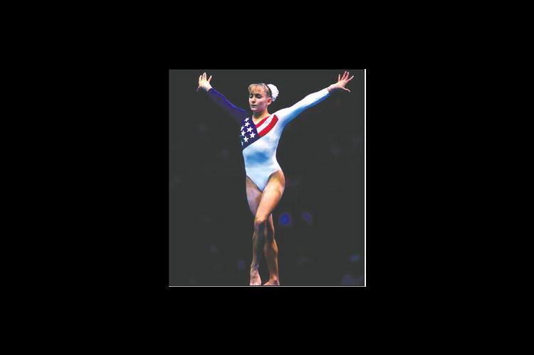Shannon Miller performs her gold medal-winning balance beam routine during the 1996 Olympic Games in Atlanta. Miller became the first American gymnast to win Olympic gold in the event. (Photo by Dave Black)