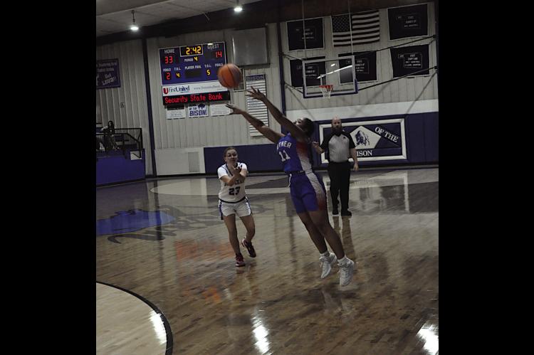 Butner Lady Eagle Gabby Banks makes the shot from three-point range Tuesday. Staff Photo by Bill Anderson