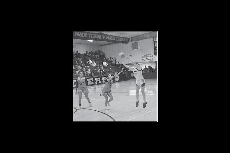 Maud Lady Tiger Aubri Kueneman takes a shot from three-point range Tuesday. Staff Photo by Bill Anderson