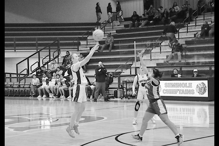 Seminole Lady Chieftain Ryeley Stanfield takes the shot from three-point range Tuesday night. Staff Photo by Bill Anderson