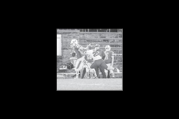 Bowlegs Bison QB Tylar Lee uses a stiff arm to get by a Paoli defender. Courtesy Photo by Glen Bryan