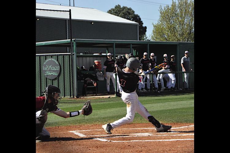 Strother Yellowjacket Peyton Moody knocks the ball into the outfield Thursday. Staff Photo by Bill Anderson