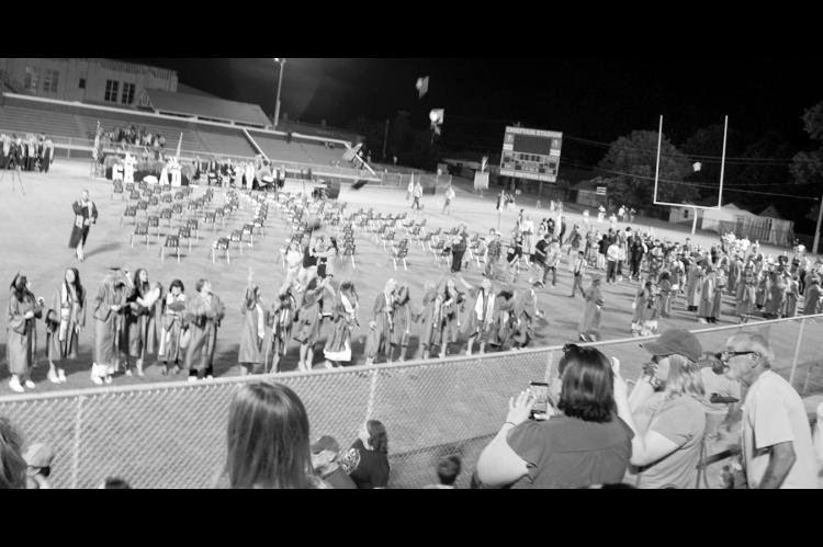 Caps fly into the air following the announcement that Seminole High School’s Class of 2026 had satisfied the requirements to graduate and move on to the next phase of life. Commencement ceremonies were held Tuesday evening at Chieftain Stadium. Wednesday was the final day of classes for all other students in the Seminole Public Schools District. —Staff Photo by Emily Loveland