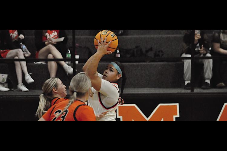 Maud Lady Tiger Amerikus Street eyes the basket before taking the shot Thursday night. Maud lost 1st round to Alex 19-51. Staff Photo by Bill Anderson