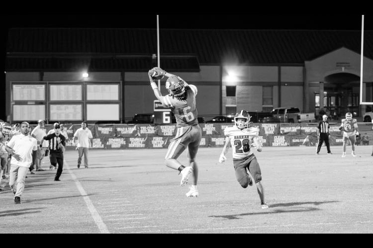 Seminole Chieftain Cashawn Thompson catches a pass for a big gain Friday night at home against Harrah Courtesy Photo by Ben Schatzel