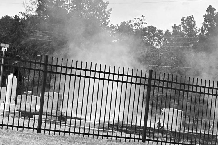 A lightning bolt struck the southern edge of Maple Grove Cemetery at around 1 p.m. Sunday, sparking a grassfire that was quickly extinguished by the Seminole Fire Department. Although lightning and thunder moved across the city, only a trace of rain fell. —Staff photo by Ken Childers