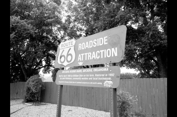A sign for the Arcadia Round Barn along Route 66 in Arcadia is pictured June 12, 2026. (Photo by Emma Murphy/Oklahoma Voice)