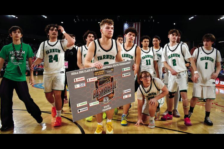 The Varnum Whippet basketball team displays a state championship bracket after defeating Glencoe in the Class B-1 boys quarterfinals Thursday in Oklahoma City. The Whippets advanced to the semifinals, where they were due to face Calumet Friday evening. Th