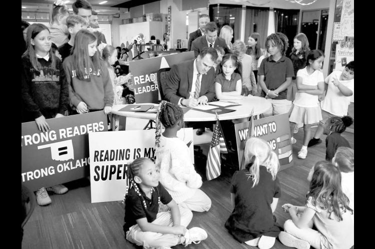 Stitt Signs Landmark Childhood Reading Bill Into Law