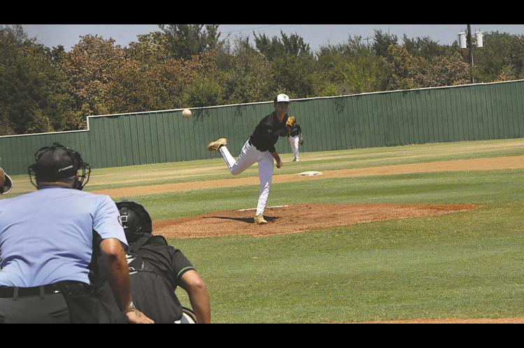 Varnum Whippet Cooper Smith throws the Heater to the waiting batter Thursday. Staff Photo by Bill Anderson