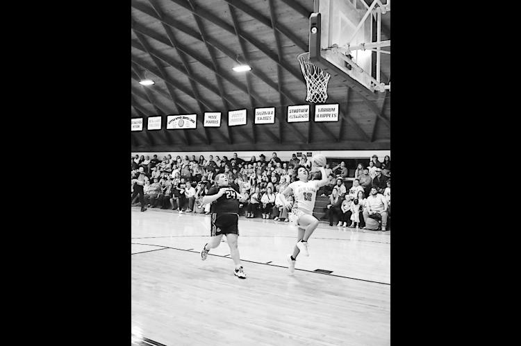 New Lima Falconette Jaidyn Hinton flies in for the layup Thursday night. Staff Photo by Andy Wilson