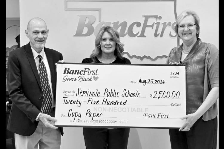 BancFirst Seminole on Tuesday donated $2,500 to Seminole Public Schools to be used for the purchase of copy paper. Pictured l-r are Superintendent Dr. Bob Gragg, Assistant Superintendent Angela Willmett and BancFirst President Debbie Kuykendall. —Courtesy photo