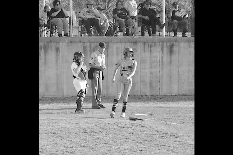 New Lima Falconette Jazzy Harjo scores a run in the first inning Monday. Staff Photo by Bill Anderson