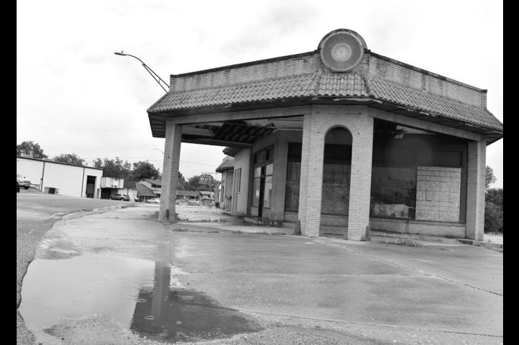 Rain puddles in front of the former bus station in Seminole Thursday morning, a welcome sight after an extended period of scorching hot temperatures and little to no rain. The last rain was reported on Aug. 22, and that was only a trace. —Staff Photo by Andy Wilson